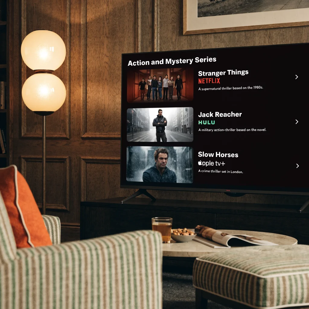 A realistic photo of a TV screen displaying action and mystery series from Netflix, Hulu, and Apple TV+, featuring characters from Stranger Things, Jack Reacher, and Slow Horses.