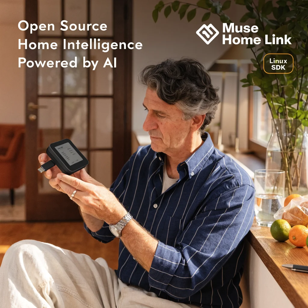 Nat Friedman demonstrating the open-source Muse Home Link smart home device with USB-C dongle and Linux SDK in a modern home setting.