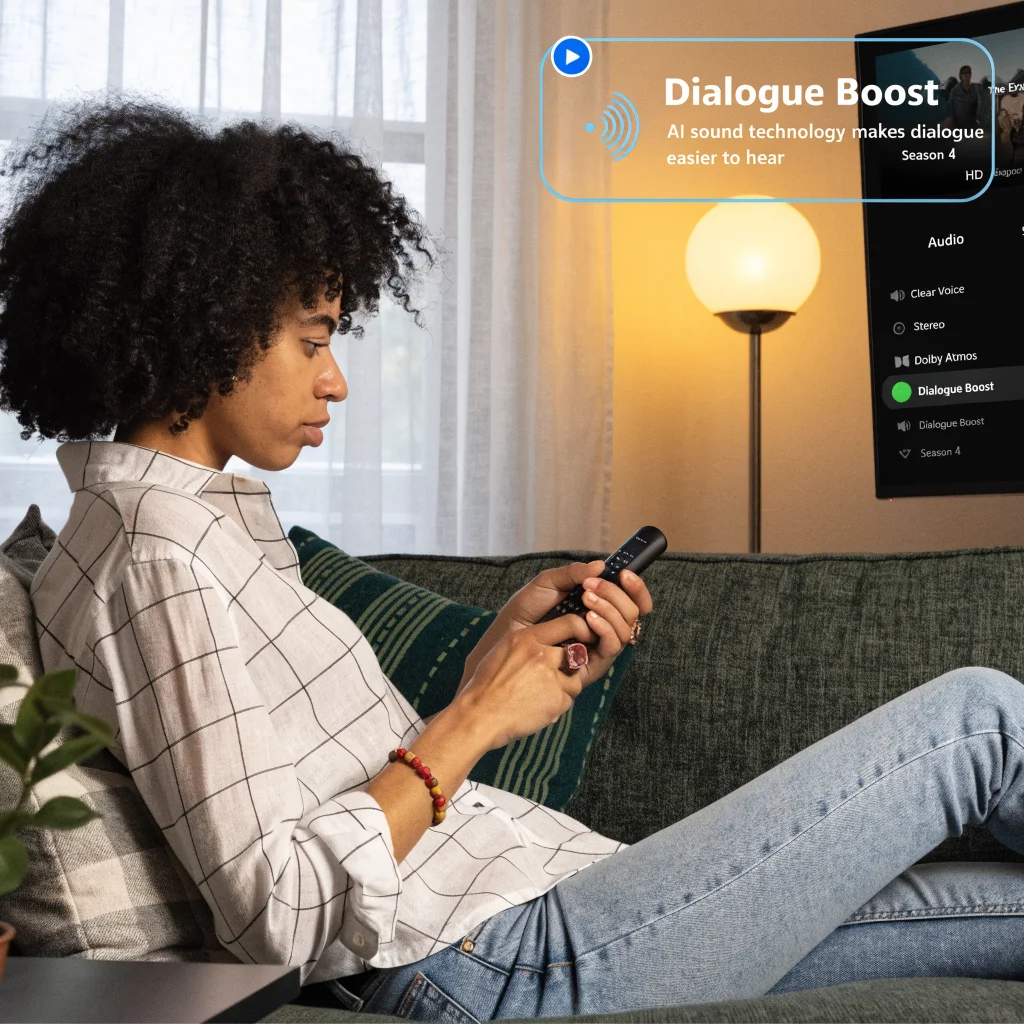 A person adjusting audio settings on an Amazon Fire TV Stick remote, highlighting Dialogue Boost for clearer movie speech using AI sound technology.
