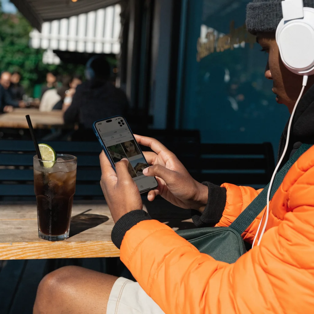A realistic photo of a user browsing Instagram in a discreet reading mode on their smartphone, highlighting limited interaction and enhanced privacy features.